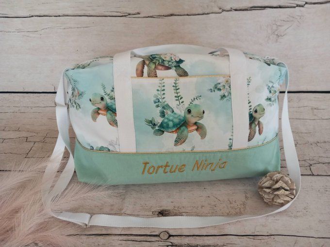Sac à langer tortue / tissu uni vert clair