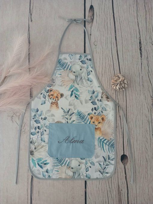 Tablier enfant animaux bleus / uni bleu clair